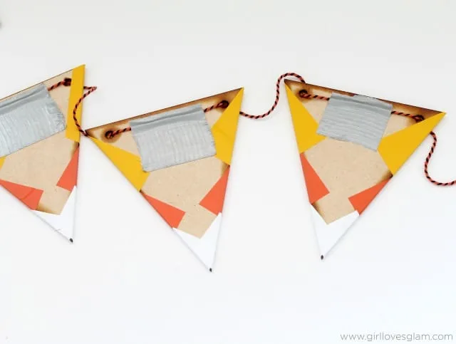 DIY Candy Corn Bunting on www.girllovesglam.com