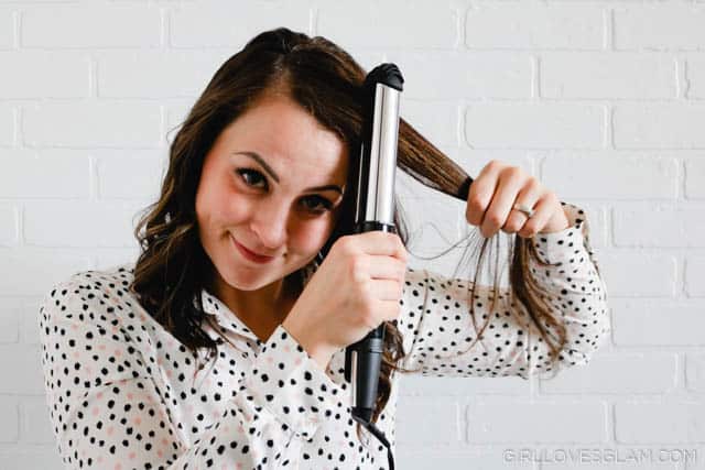 Curling hair with a flat iron on www.girllovesglam.com